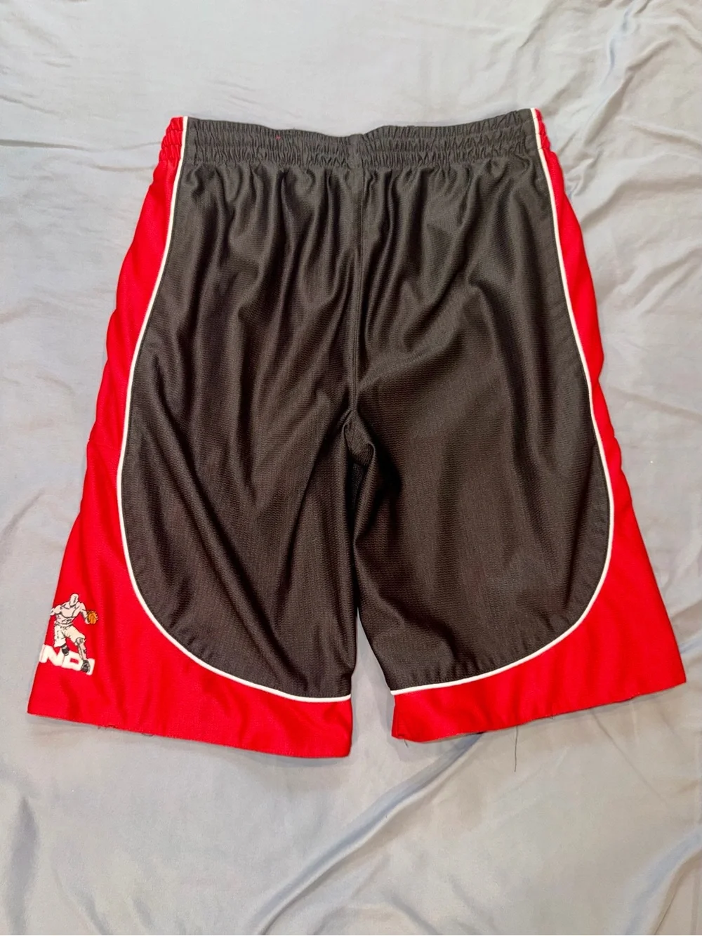 Men's Red Athletic Shorts with 'AND ONE' Leg Branding